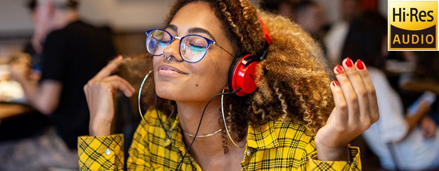 Girl with wearing yellow shirt listen to Hi-res music with red headset