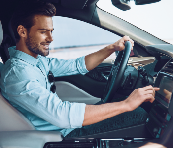 guy wearing Blue Shirt adjusting Car Receiver mobile