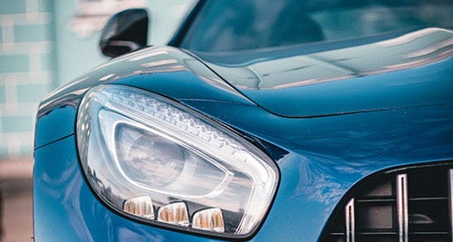 Blue shiny car new detailed left headlight