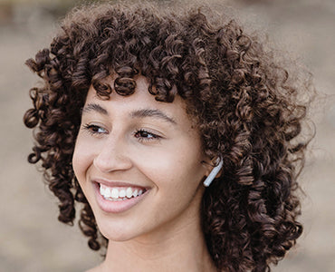 Girl wearing BlueTooth device