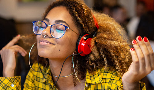  girl wearing yellow shirt listen hi resolution music with red headphones smaller Mobile