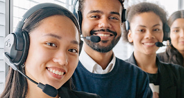 Group of customer service people wearing headphones mobile