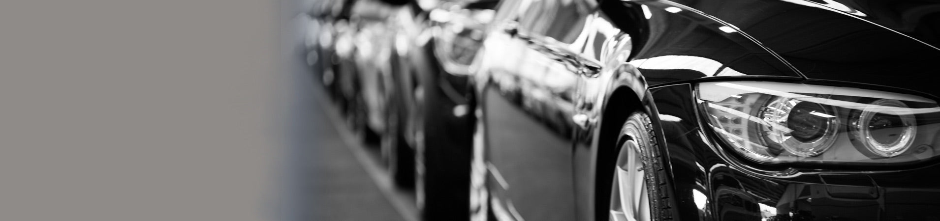 black and white image fleet a cars in a row