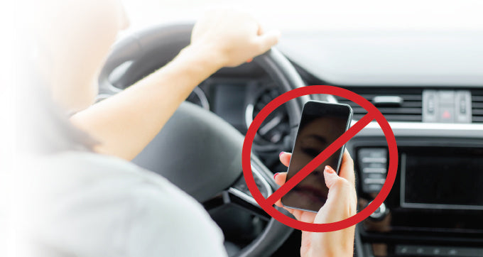 Distracted driver reading cellphone while driving  moblie